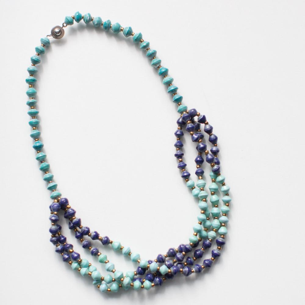 JustOne's paper bead necklace in teal and navy, handcrafted in Uganda